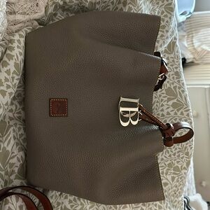 Dooney and Burke …. Used once like brand new. Too small for my liking .